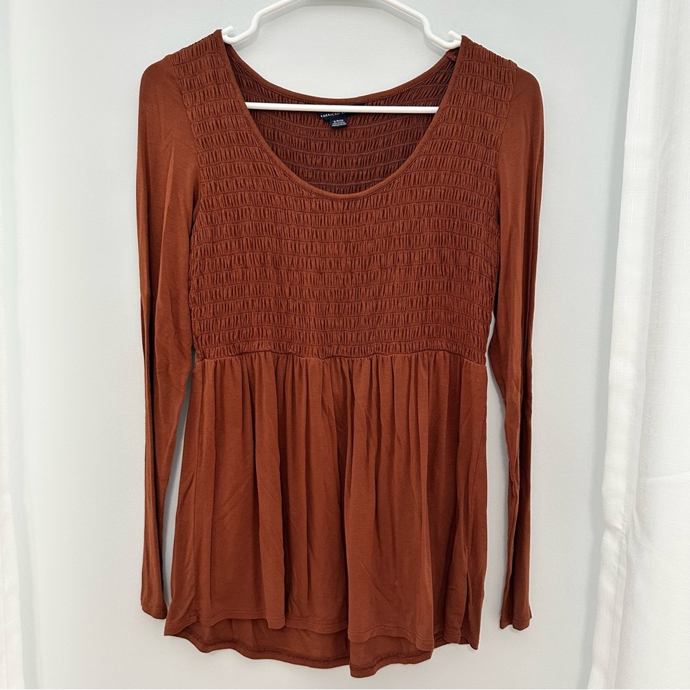 Smocked Peplum Long Sleeve Top